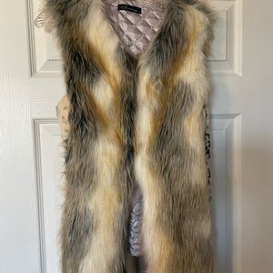 Lined faux fur vest. Size small.
